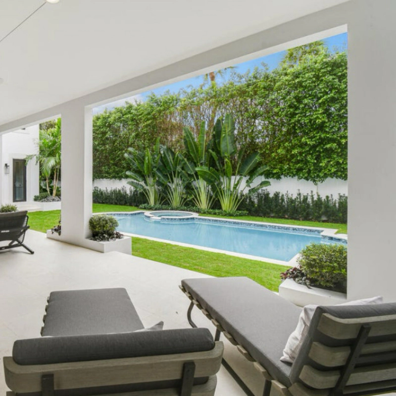 luxurious pool surrounded by green landscape